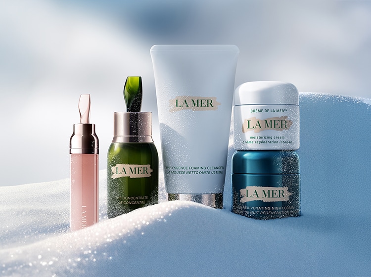 Selection of La Mer bestselling, nestled in snow, in an artic setting